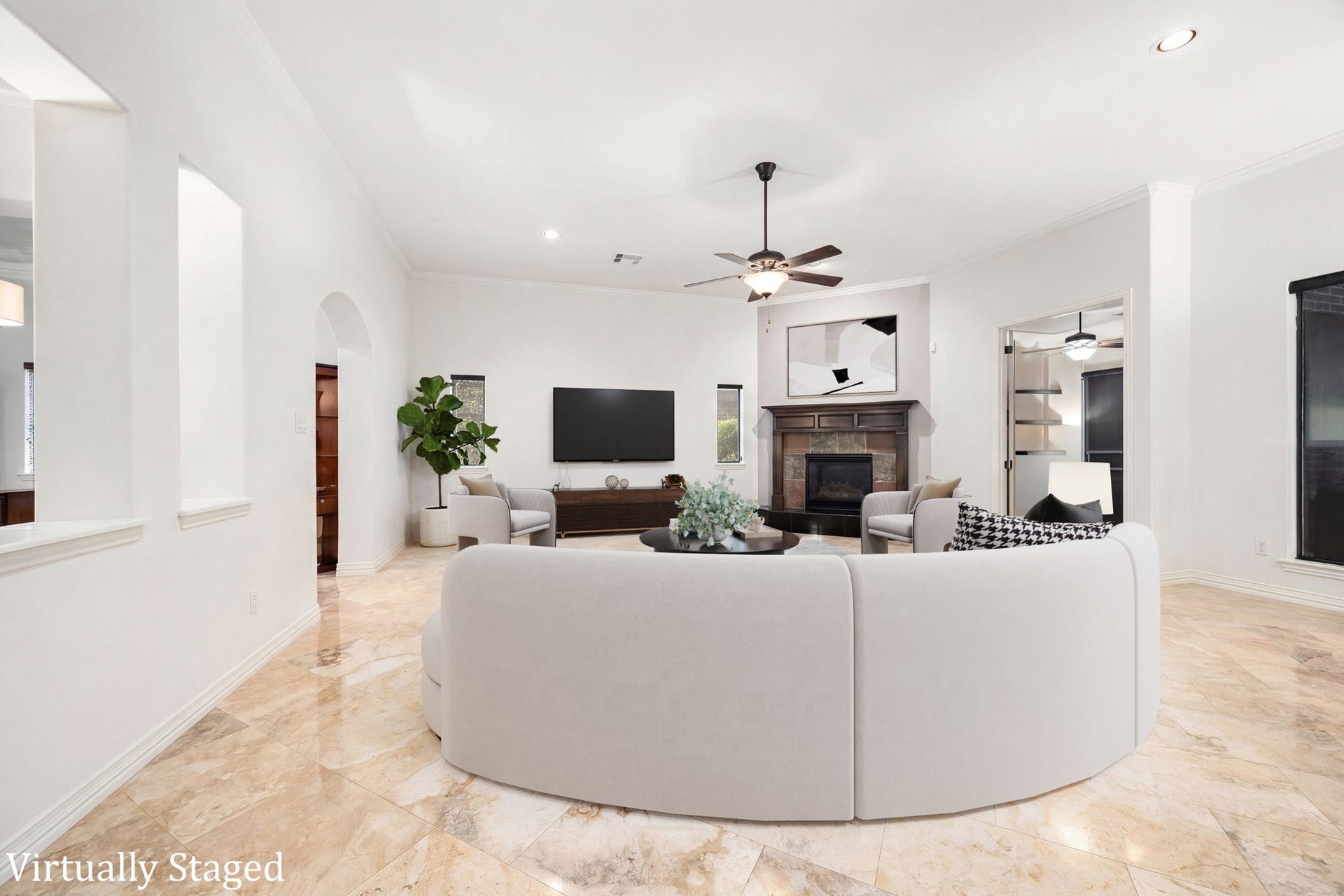 195 Oarwood Place, The Woodlands, TX 77389 Large family room with a corner fireplace, high ceilings, and plenty of space for relaxing or gathering with family and friends. Virtually Staged.