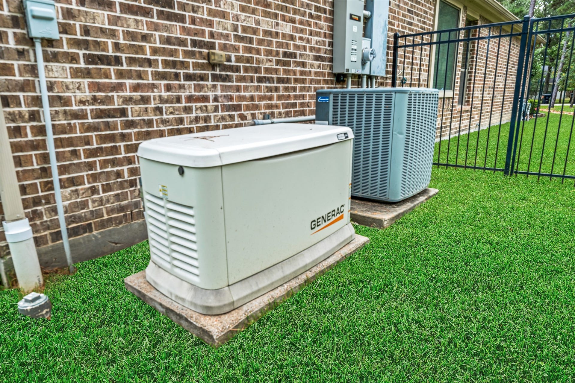 903 Weeping Willow Way, Magnolia, TX 77354 Equipped with a reliable Generac generator and an efficient outdoor HVAC unit, ensuring comfort and peace of mind.