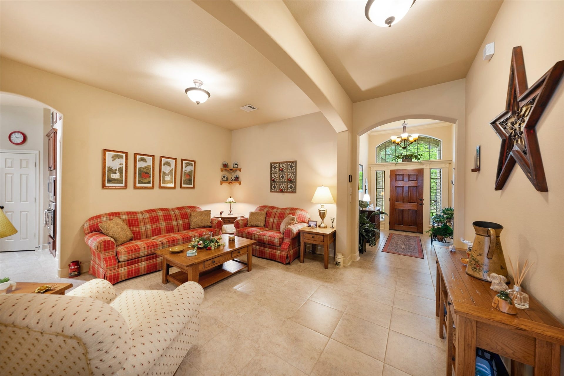 903 Weeping Willow Way, Magnolia, TX 77354 This is view back to foyer and shows what is actually a spacious formal dining room but seller opted to use as another sitting area. They have the chandelier to complete the look if buyer wants to use as dining room.