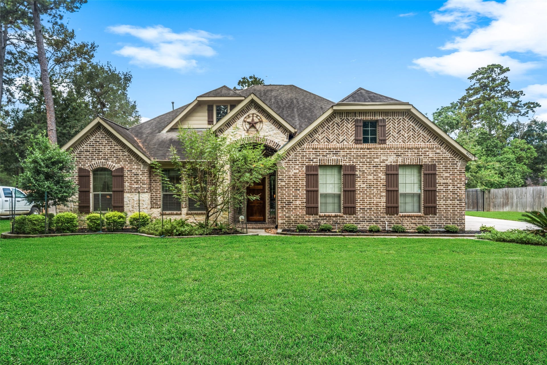 903 Weeping Willow Way, Magnolia, TX 77354 This attractive brick and stone home with great curb appeal is in popular Westwood subdivision.