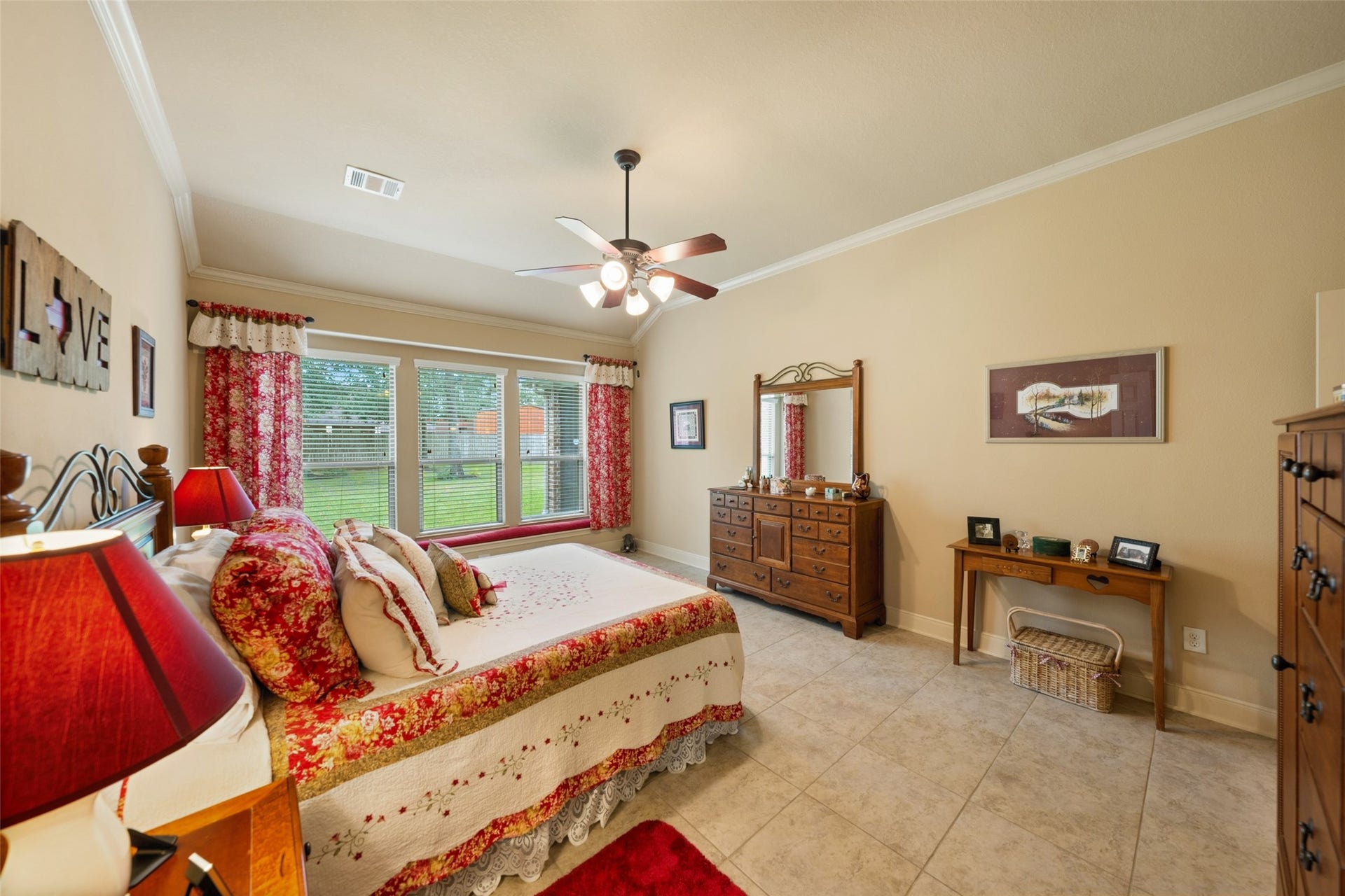 903 Weeping Willow Way, Magnolia, TX 77354 Spacious bedroom with large windows offering natural light, tile flooring and crown molding