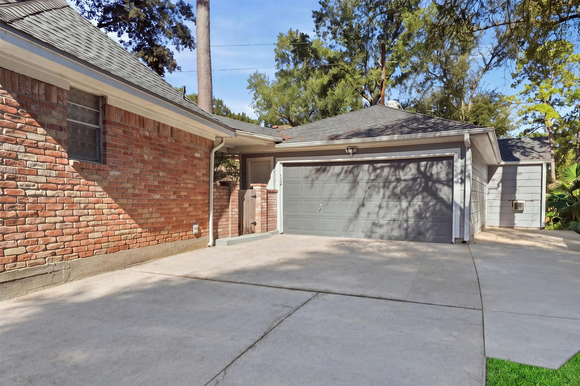 3303 Flickering Candle Drive, Spring, TX 77388 Extended driveway provides additional parking space.