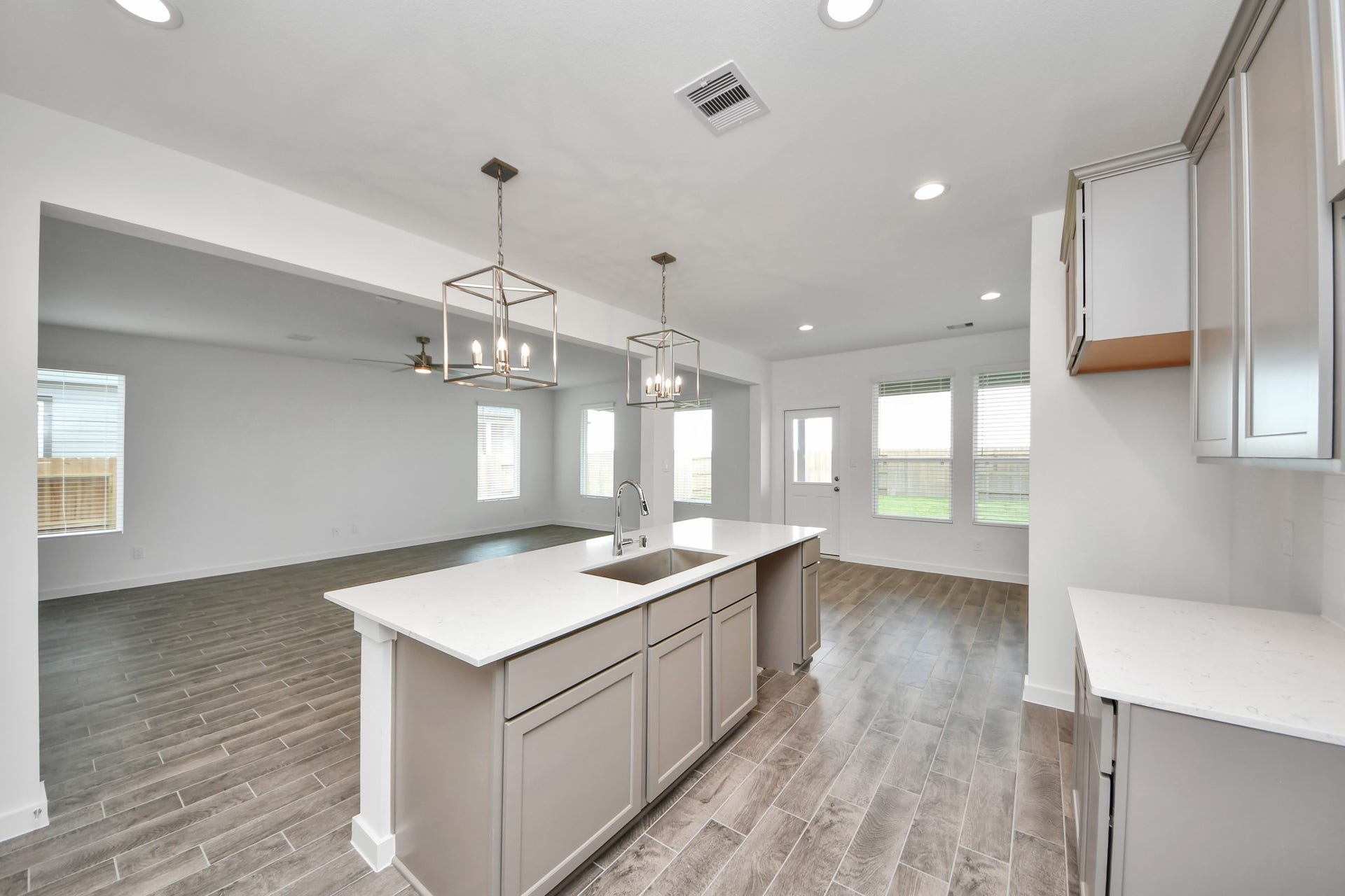 14702 Freestone Plum Court, Houston, TX 77049 This generously spacious kitchen is a dream realized! Sample photo of completed home with similar floor plan. Actual colors and selections may vary.