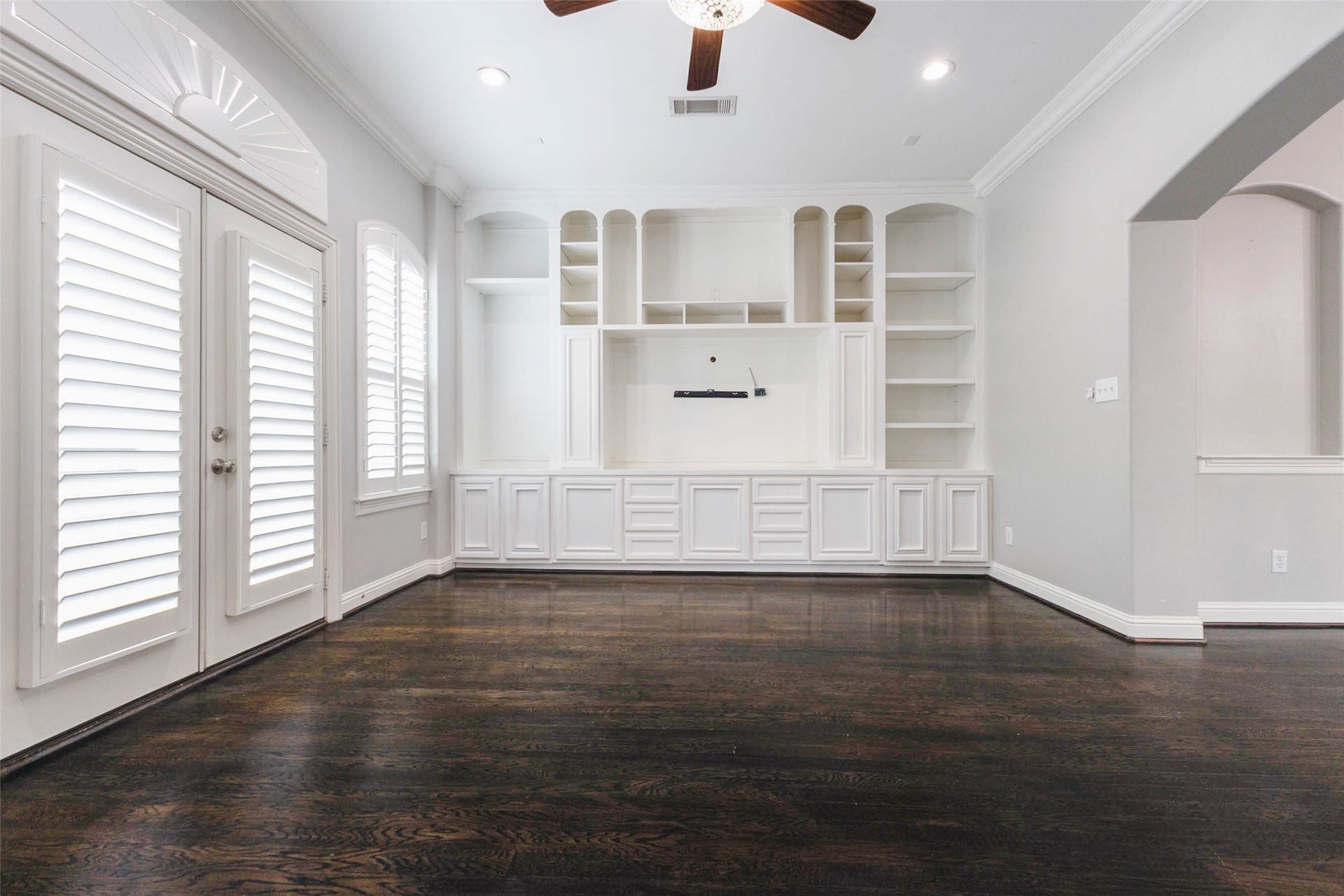 Really pretty custom shelving in this space not only increased the amount of storage you have exponentially but also gave this space an elevated feel!