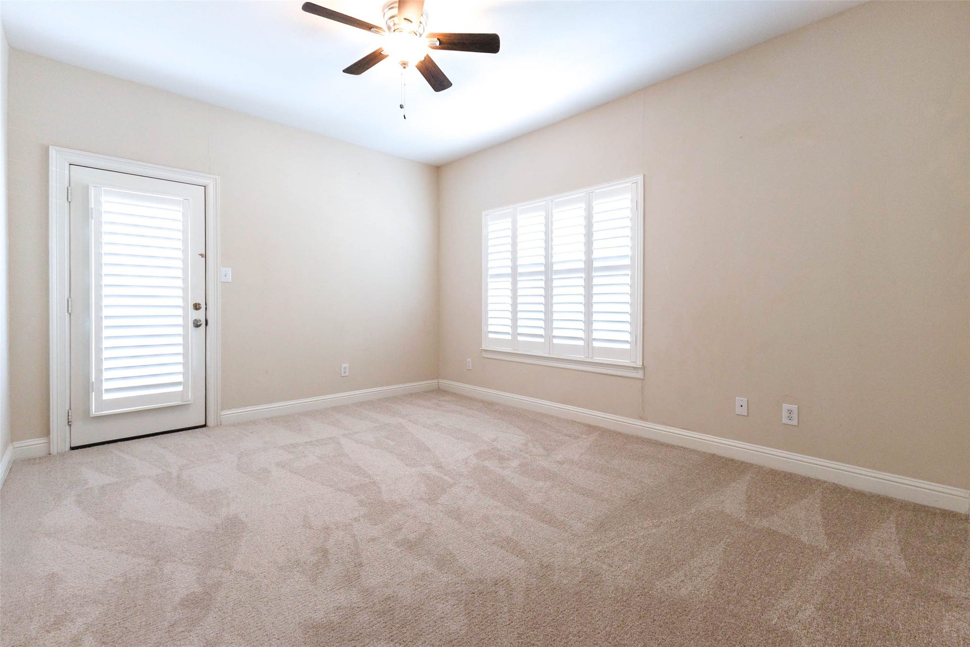 After parking in the garage, walk in and you'll immediately be greeted by your game room! The door leads to a small outdoor space.