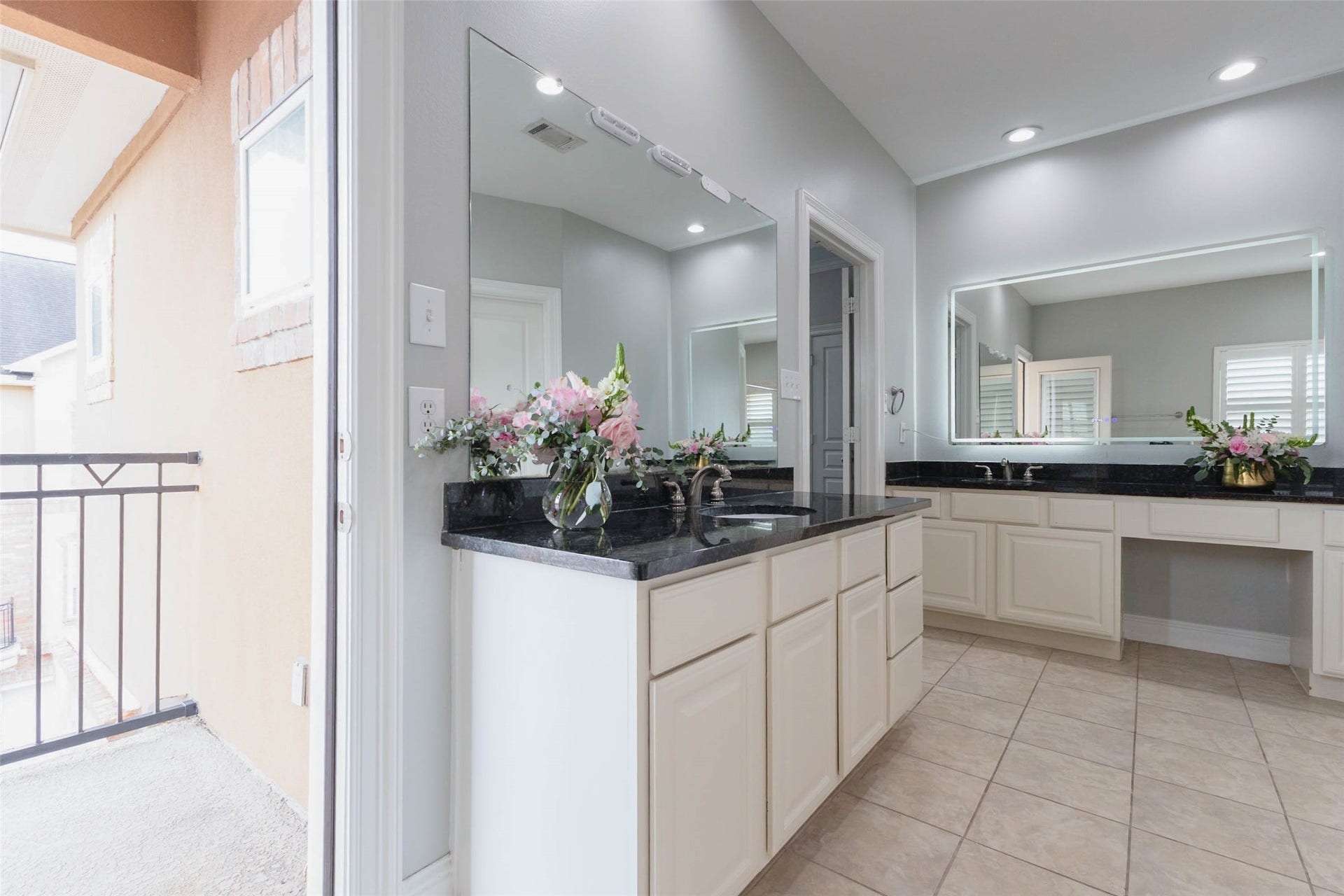 There's more than enough space for you both to get ready here. A balcony off the bathroom too!
