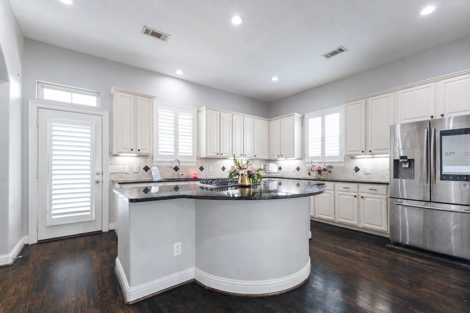 If you love to bake... you'll go crazy when you see how much counter space you have to work with on this GIGANTIC island! It's unheard of for a townhome with this much cabinet storage, and counter top prep space.