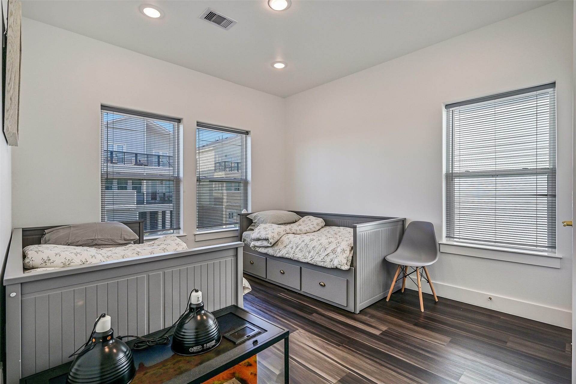 3627 Niko Court, Galveston, TX 77554 The first of two bedrooms youll find is this spacious and inviting guest bedroom.