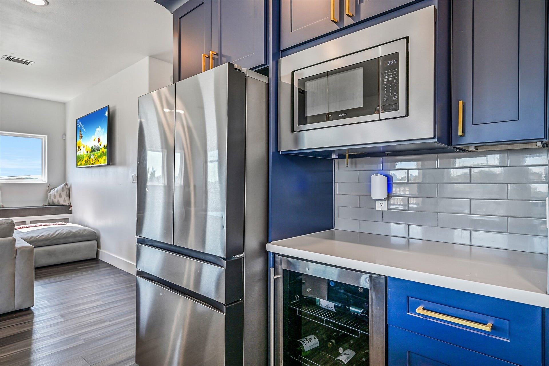 3627 Niko Court, Galveston, TX 77554 The kitchen also features a wine fridge, Samsung refrigerator, Maytag dishwasher, and Whirlpool microwave.