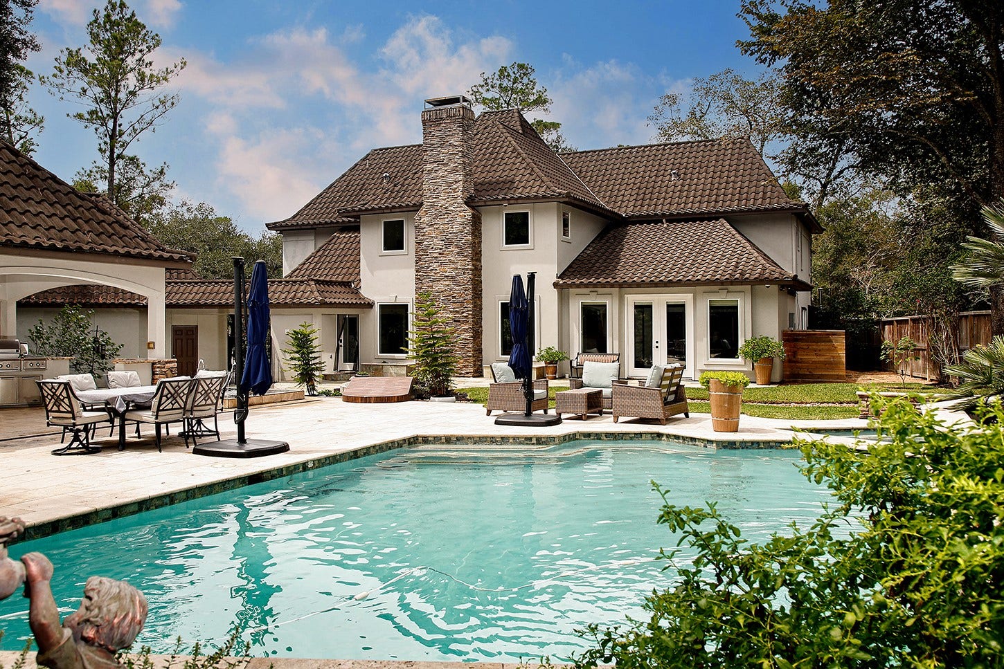 16 Wild Ginger Court, The Woodlands, TX 77380 Extraordinary custom estate has a sophisticated European style, with new modern finishes, on an oversized estate lot including a modern pool/spa, outdoor kitchen, pristine landscaped grounds, creating a luxurious resort-like feel in backyard. Premium metal roof and 3-car detached garage.