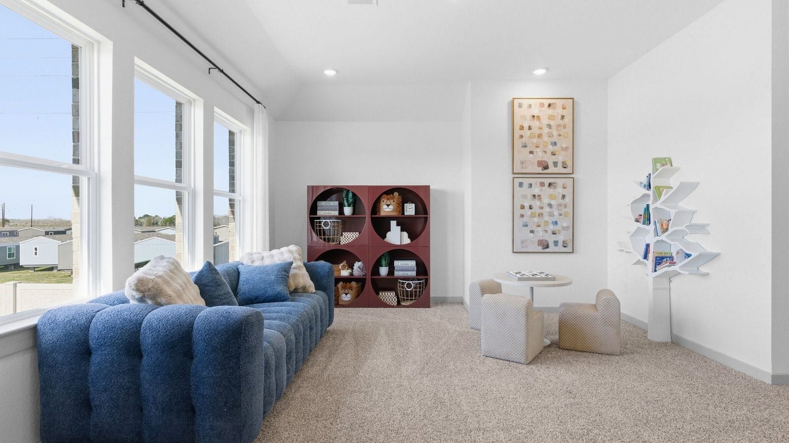 2507 Friendswood Trail, Friendswood, TX 77546 A spacious upstairs living area with plenty of natural light from windows overlooking side of the home