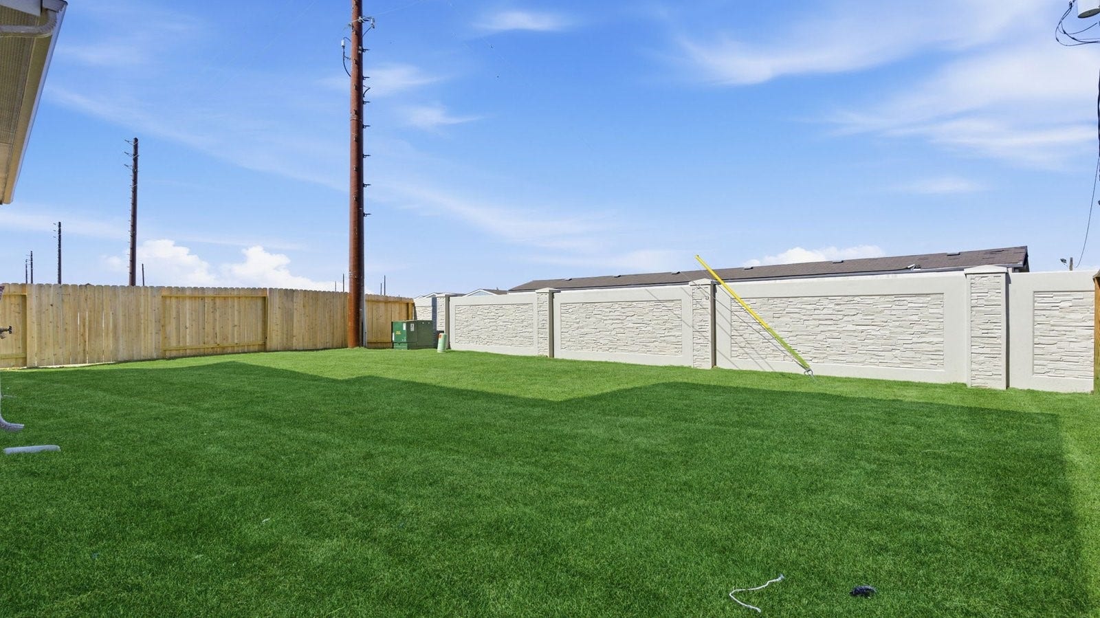 2507 Friendswood Trail, Friendswood, TX 77546 Large fenced-in backyard with a covered patio, perfect for outdoor entertaining.