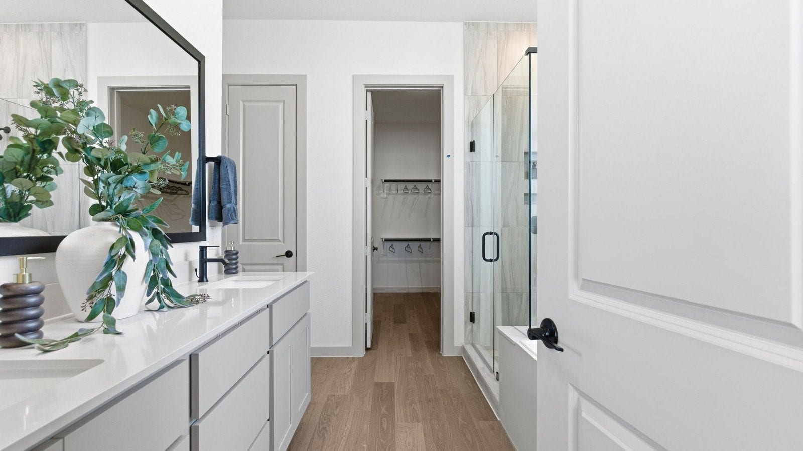 2507 Friendswood Trail, Friendswood, TX 77546 Luxurious primary bathroom with dual vanities, a soaking tub, and separate glass-enclosed walk in shower