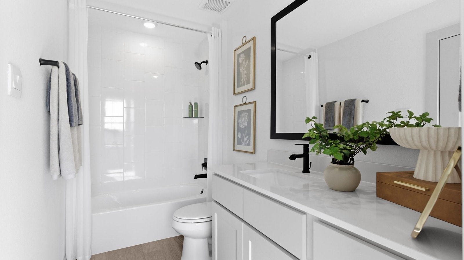 2507 Friendswood Trail, Friendswood, TX 77546 A well-designed bathroom equipped with quartz countertops, a standing tub, and a single vanity.