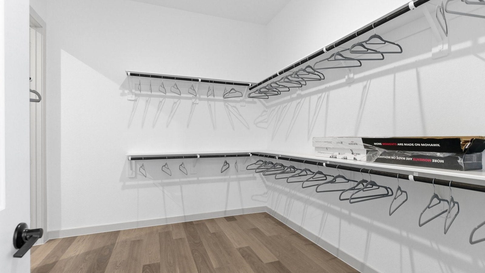 2507 Friendswood Trail, Friendswood, TX 77546 The primary walk-in closet with two rows of shelves and rods for maximum storage opportunities
