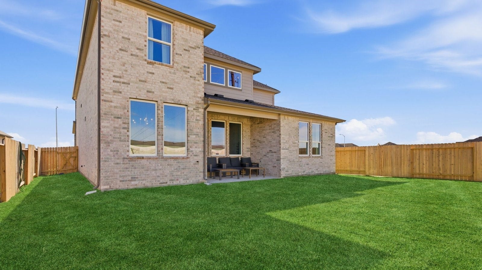 2507 Friendswood Trail, Friendswood, TX 77546 Large fenced-in backyard with a covered patio, perfect for outdoor entertaining.
