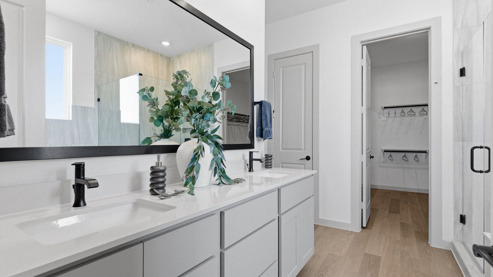 2507 Friendswood Trail, Friendswood, TX 77546 Primary bathroom with a glass-enclosed standing shower and separate soaking tub.