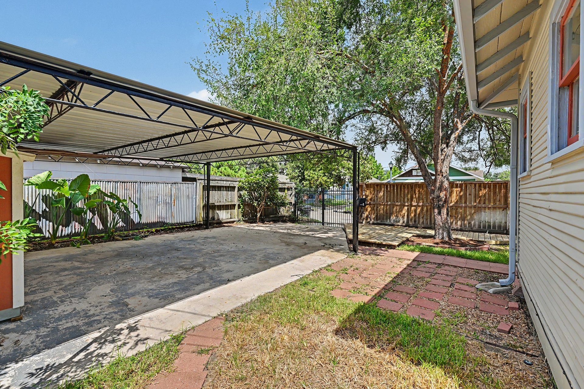 Another view of the patio and 2-car carport.