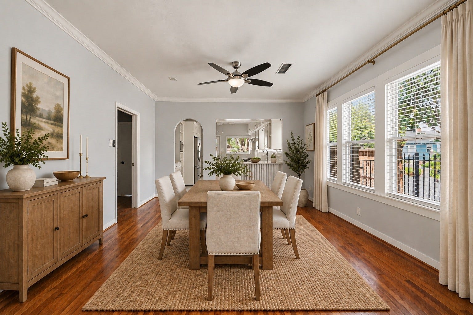 Virtually staged dining room illustrates the generous space and its ability to comfortably accommodate a dining table and chairs.
