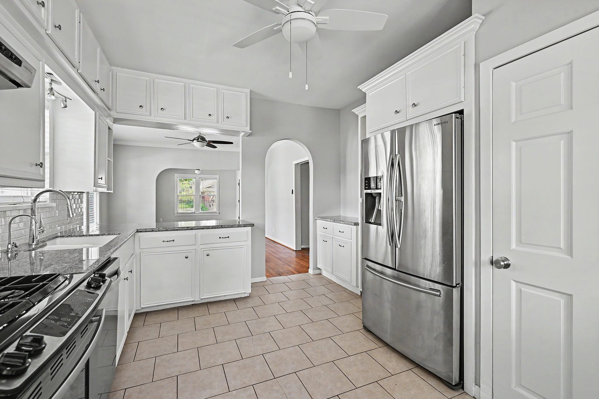 Additional kitchen view highlights the functional layout, with plenty of space to prep and cook meals.