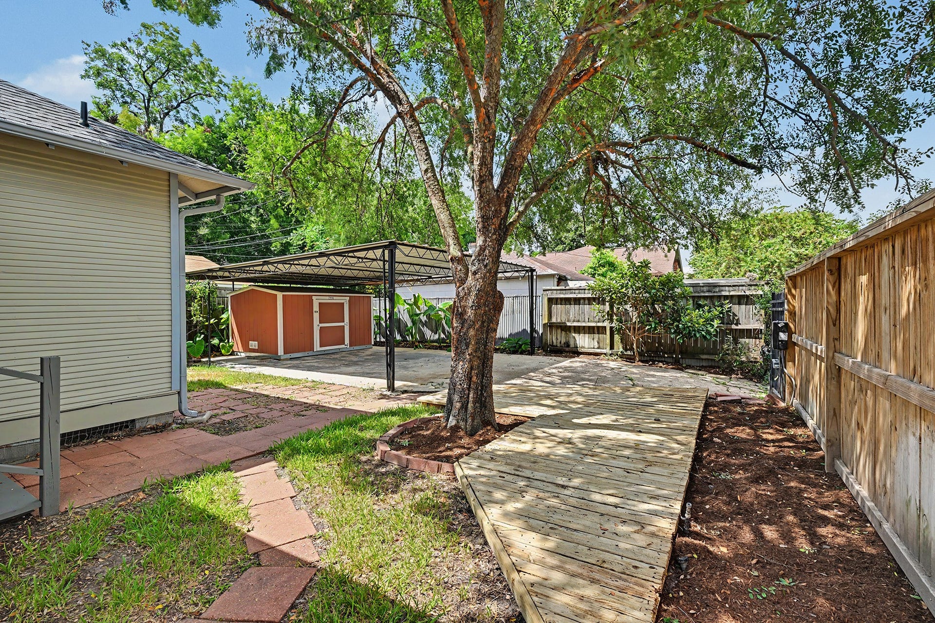 Shaded deck area provides a comfortable outdoor setting with space for seating or dining.