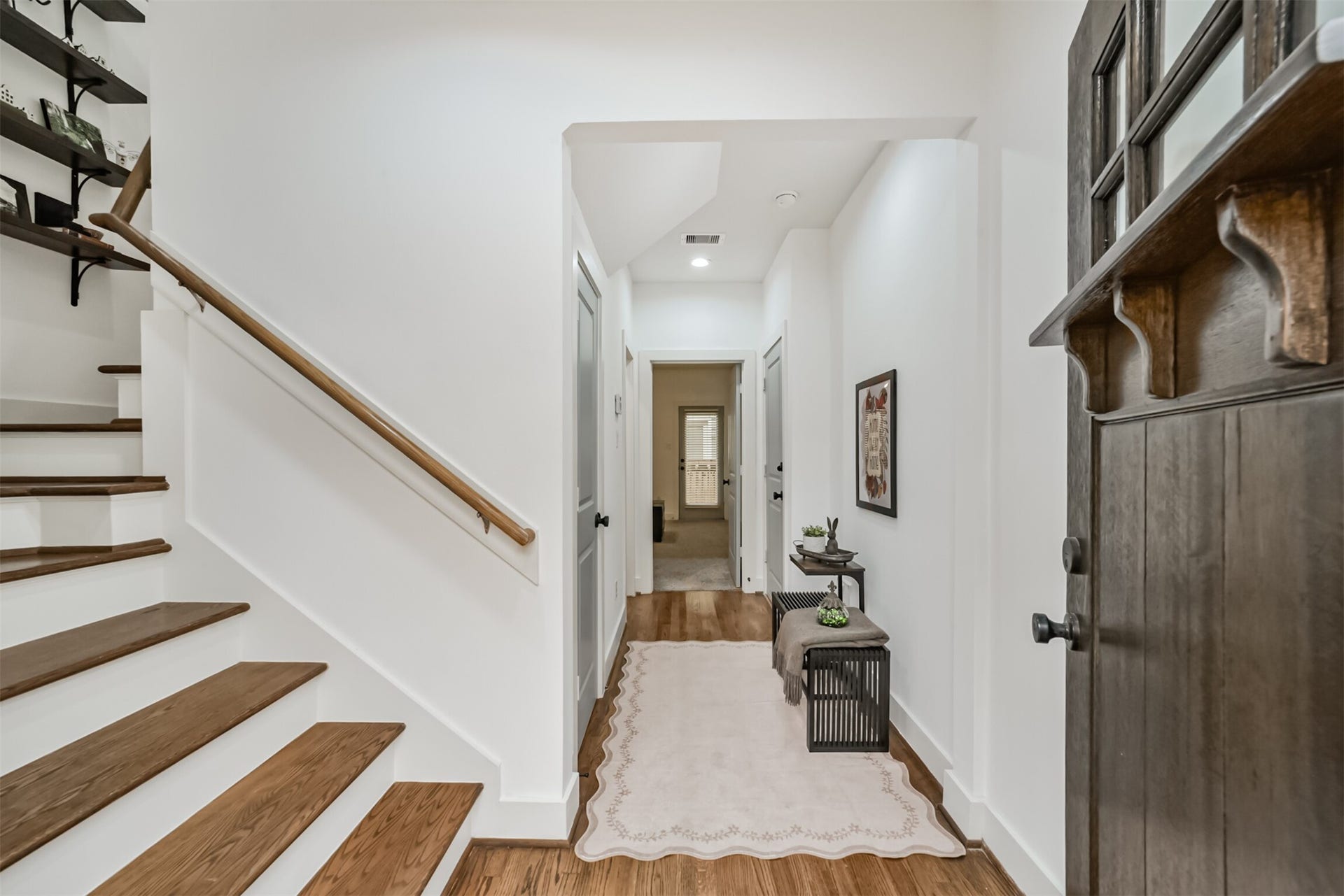 1721 W 24th Street, Houston, TX 77008 Warm, inviting entry with gleaming hardwood floors and a stylish staircase