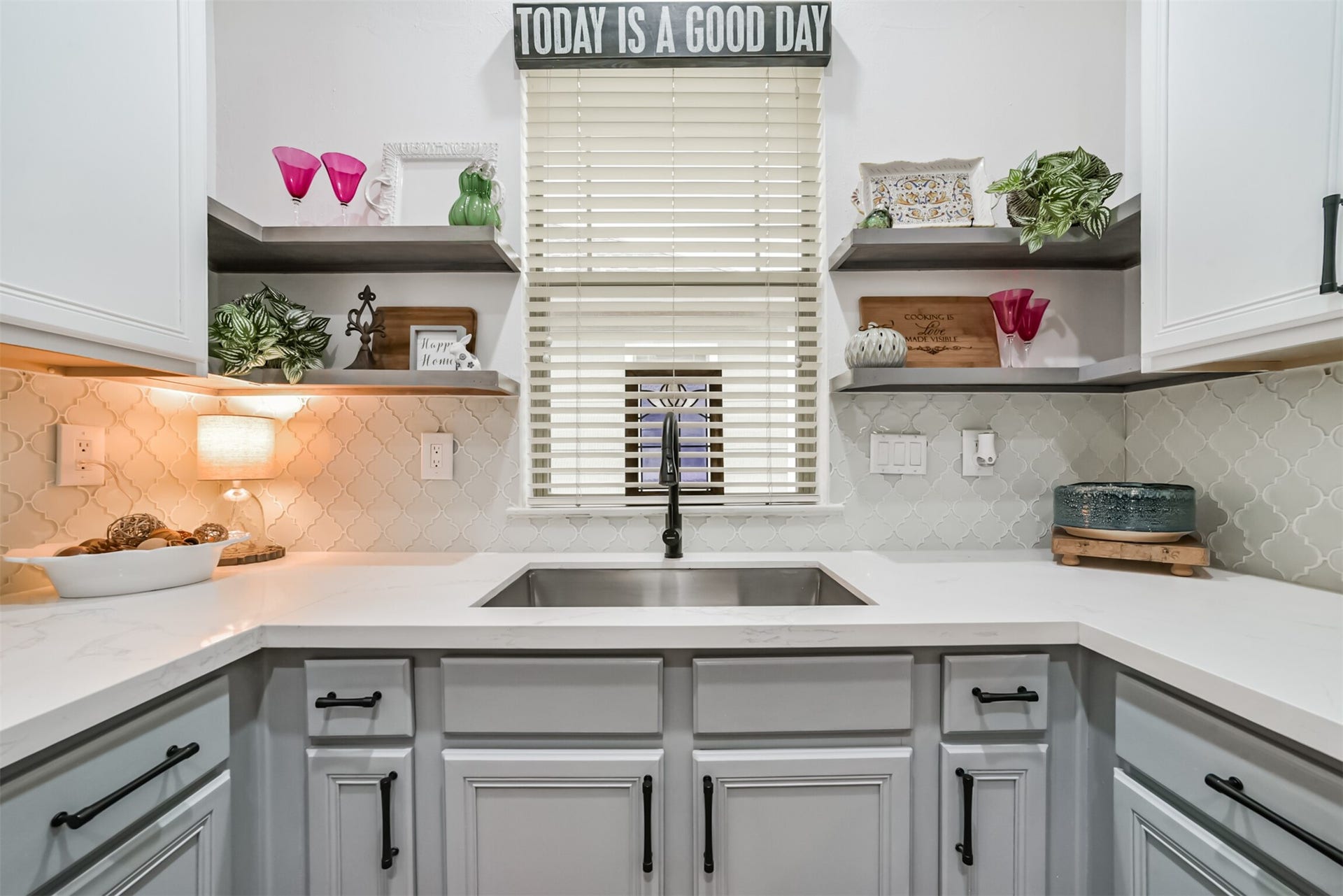 1721 W 24th Street, Houston, TX 77008 Charming window over the stainless sink, with open shelving and designer tile for effortless style