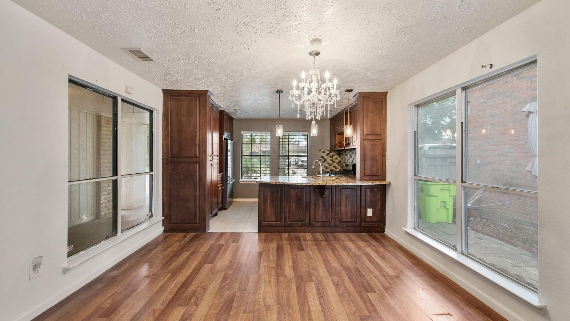 2012 Sandy Knoll Drive, Missouri City, TX 77489 Dining area featuring wood flooring, abundant natural light, and an open view into the kitchen.