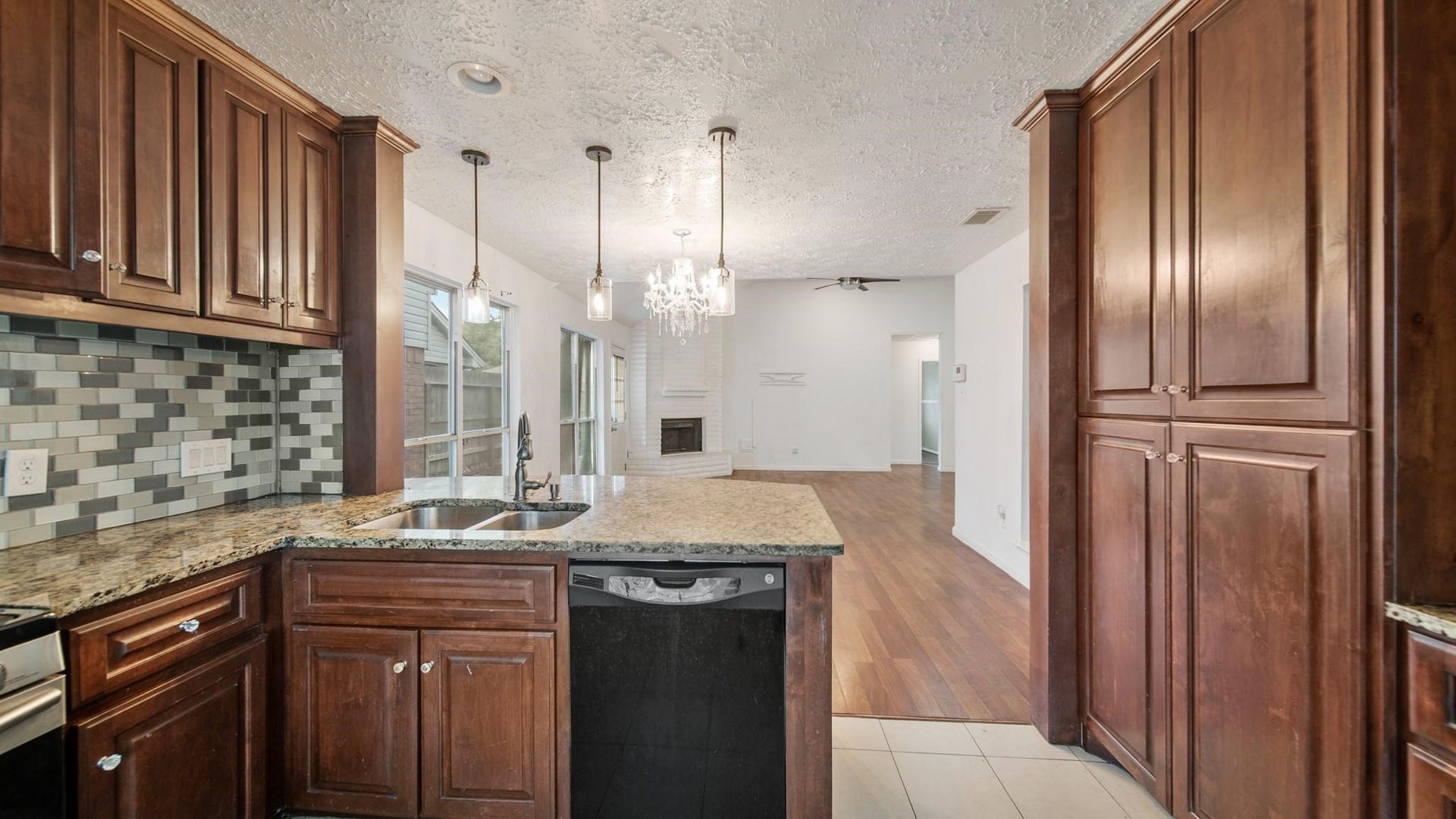 2012 Sandy Knoll Drive, Missouri City, TX 77489 View from the kitchen highlighting the open layout into the dining and living areas.
