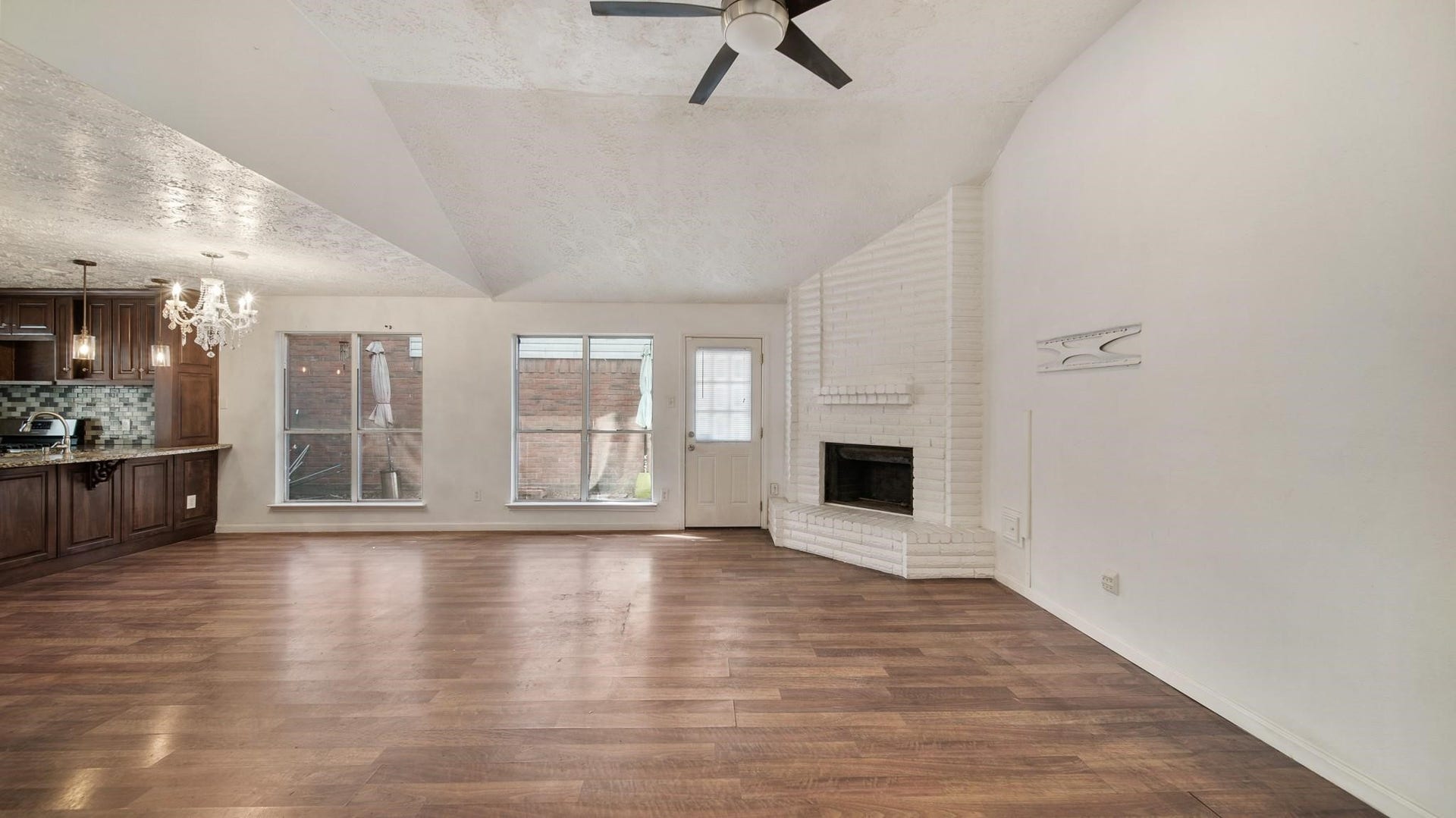 2012 Sandy Knoll Drive, Missouri City, TX 77489 Living area with vaulted ceiling and plenty of natural light from multiple windows.