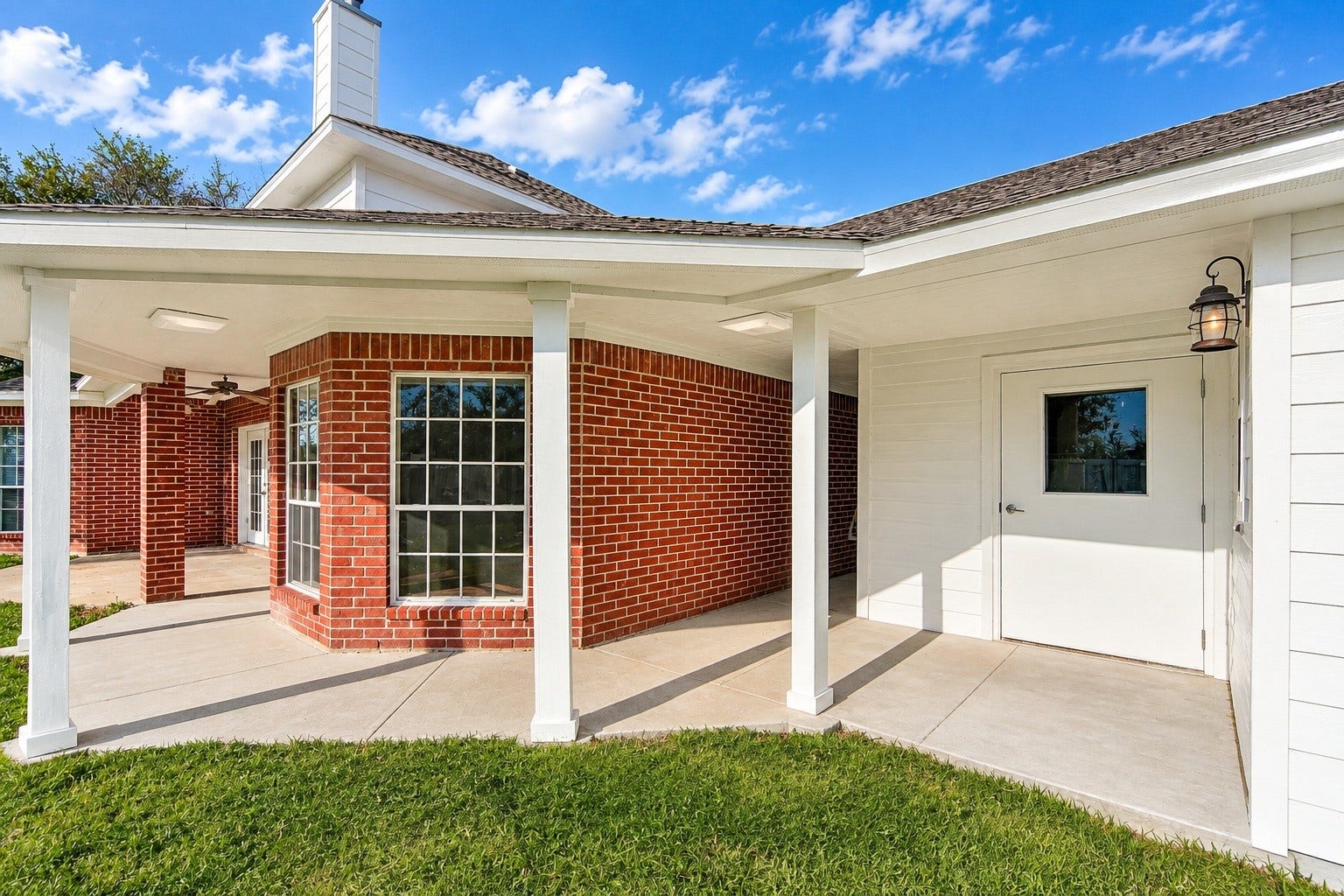 4030 Larkspur Street, Alvin, TX 77511 Charming home with a stylish brick exterior and a welcoming covered walkway, perfect for enjoying the outdoors.