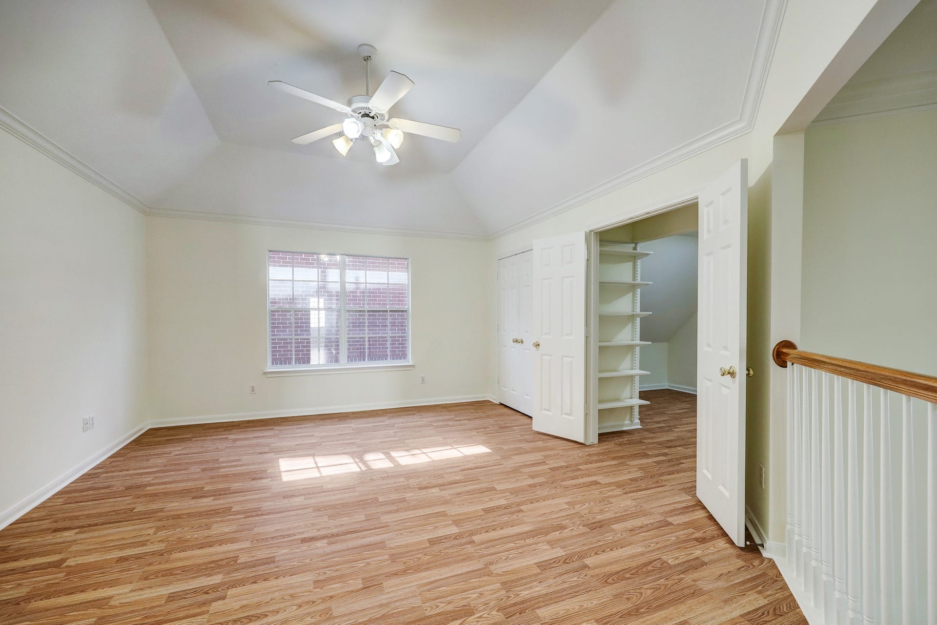 3608 Timberside Circle Drive, Houston, TX 77025 GAME ROOM: Bright and versatile space with a large window, ceiling fan, and generous built-in storage behind double doorsperfect for games, hobbies, or a secondary living area.