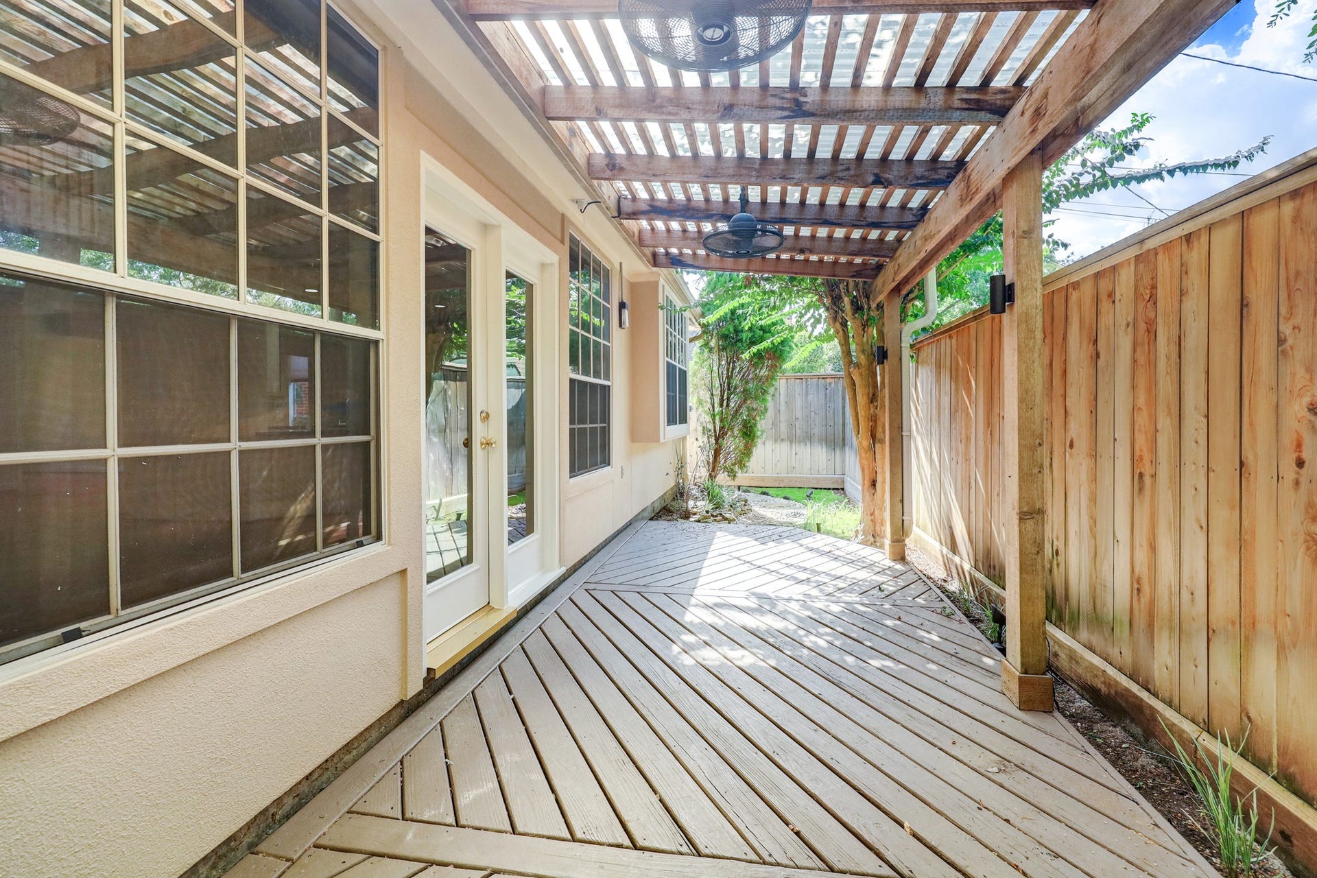 3608 Timberside Circle Drive, Houston, TX 77025 PATIO: A safe and inviting space for kids to play, thanks to gated access and minimal car traffic. Local children often enjoy outdoor play right out front.