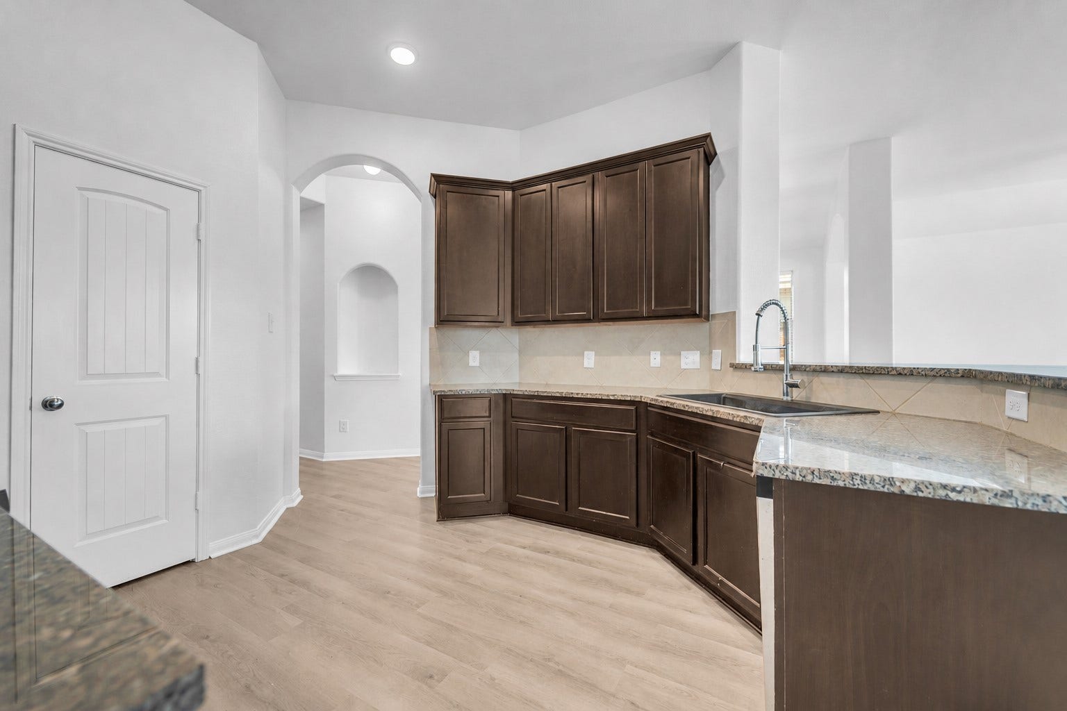 4707 Waukegan Road, Conroe, TX 77306 It includes a convenient pantry, providing extra storage space for ingredients, cookware, and everyday essentials while keeping the counters organized.