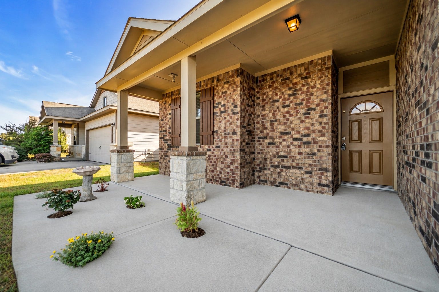 4707 Waukegan Road, Conroe, TX 77306 Enjoy the outdoors from the inviting front patio, a comfortable spot to unwind while taking in views of the surrounding neighborhood.