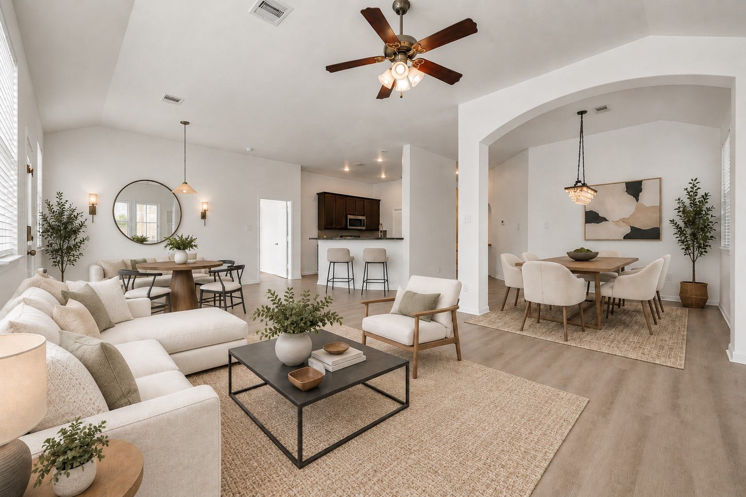 4707 Waukegan Road, Conroe, TX 77306 This great room showcases the living room, dining area, and kitchen flowing together in one open-concept layout, perfect for both everyday living and entertaining. (Virtually Staged)