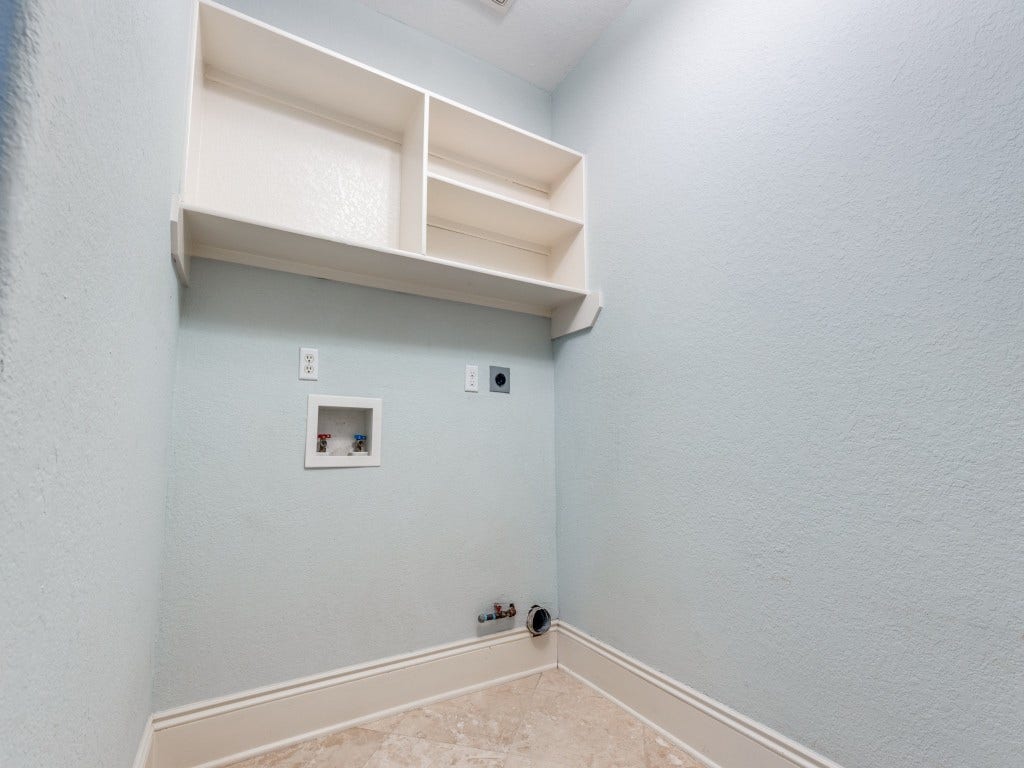2811 Princeton Street, Houston, TX 77009 The laundry room connects to the garage for a private entrance to the house.