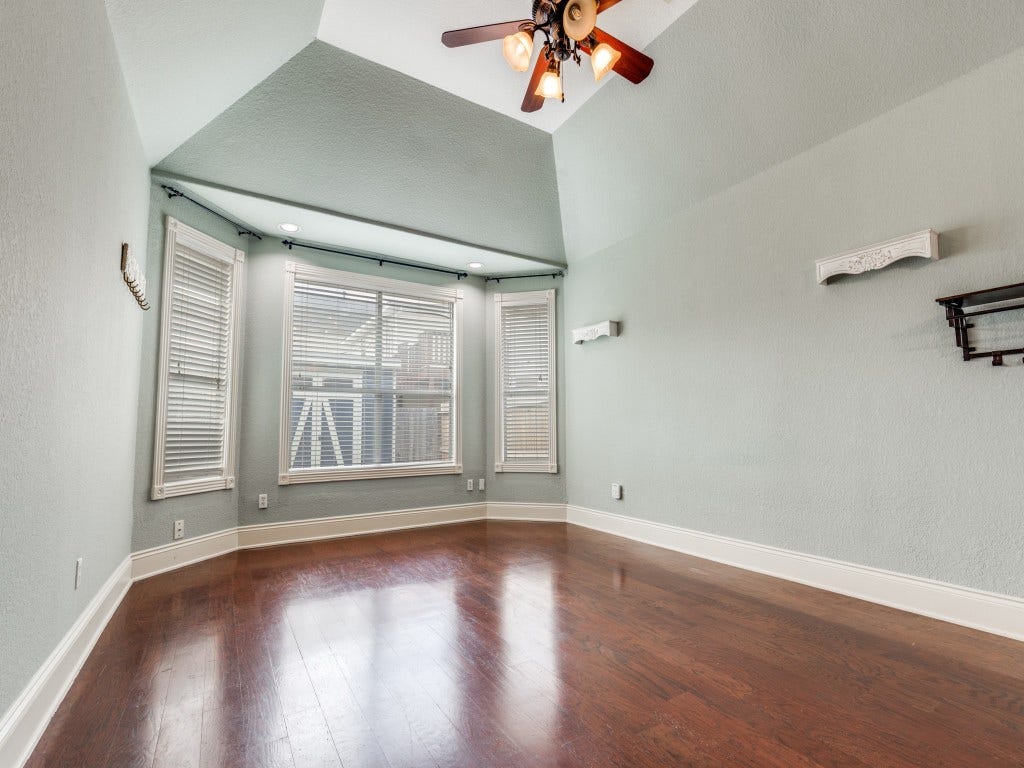 2811 Princeton Street, Houston, TX 77009 Bright primary room with large windows and a vaulted ceiling. Space is large enough to have a sitting area by the windows.