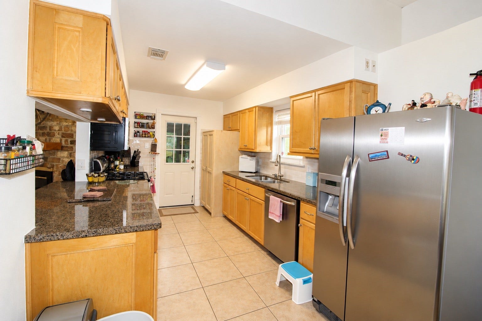 13767 Greywood Drive, Sugar Land, TX 77498 Kitchen entrance featuring ample counter and cabinet space