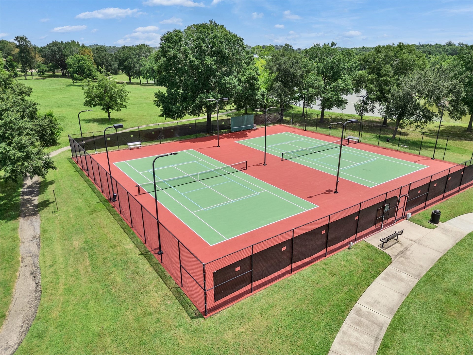 1211 Sterling Court, Katy, TX 77494 Discover the vibrant lifestyle at Woodcreek Reserve, where stunning tennis courts and extensive walking trails around a scenic lake offer unparalleled amenities for outdoor enthusiasts.