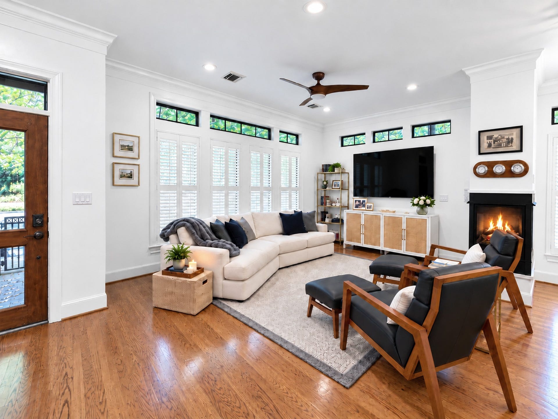 54 Riva Row, The Woodlands, TX 77380 Step inside this luxury home to discover an open concept living area with hardwood floors and double sided fireplace.