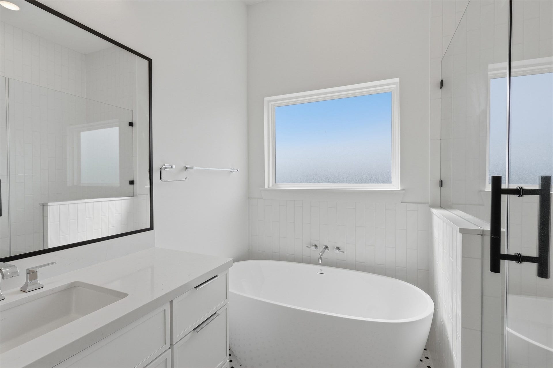 904 Kern Street, #C, Houston, TX 77009 A freestanding tub sits beside the window, with a separate shower alongside it.
