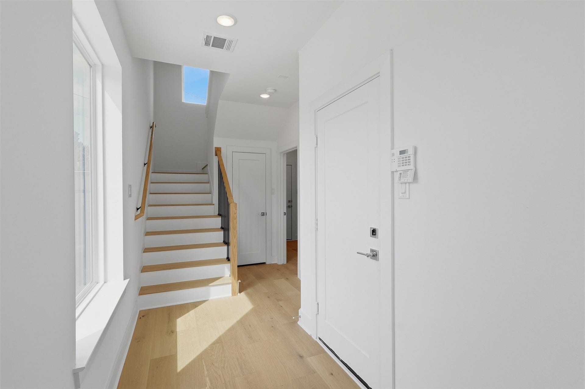 904 Kern Street, #C, Houston, TX 77009 The entry hall connects the lower level to the main living area above.