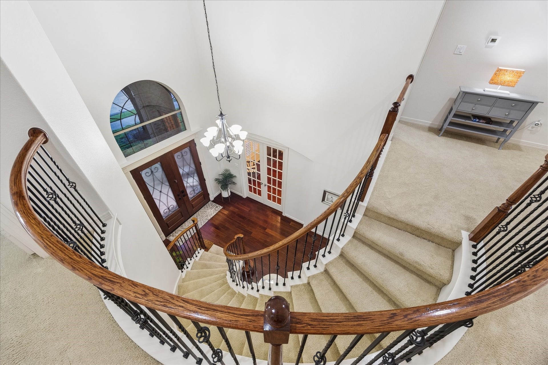 The gorgeous circular stair is a stunning design element.