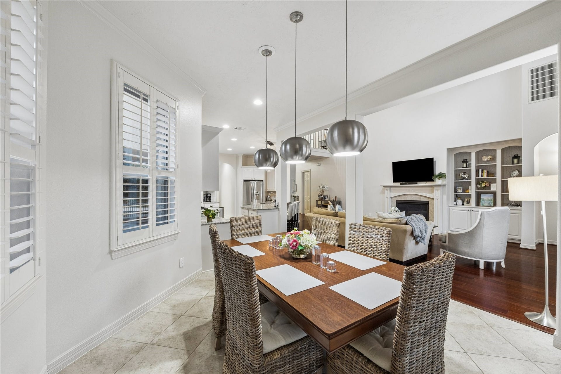 The breakfast room has access to the back porch and the garage entry.