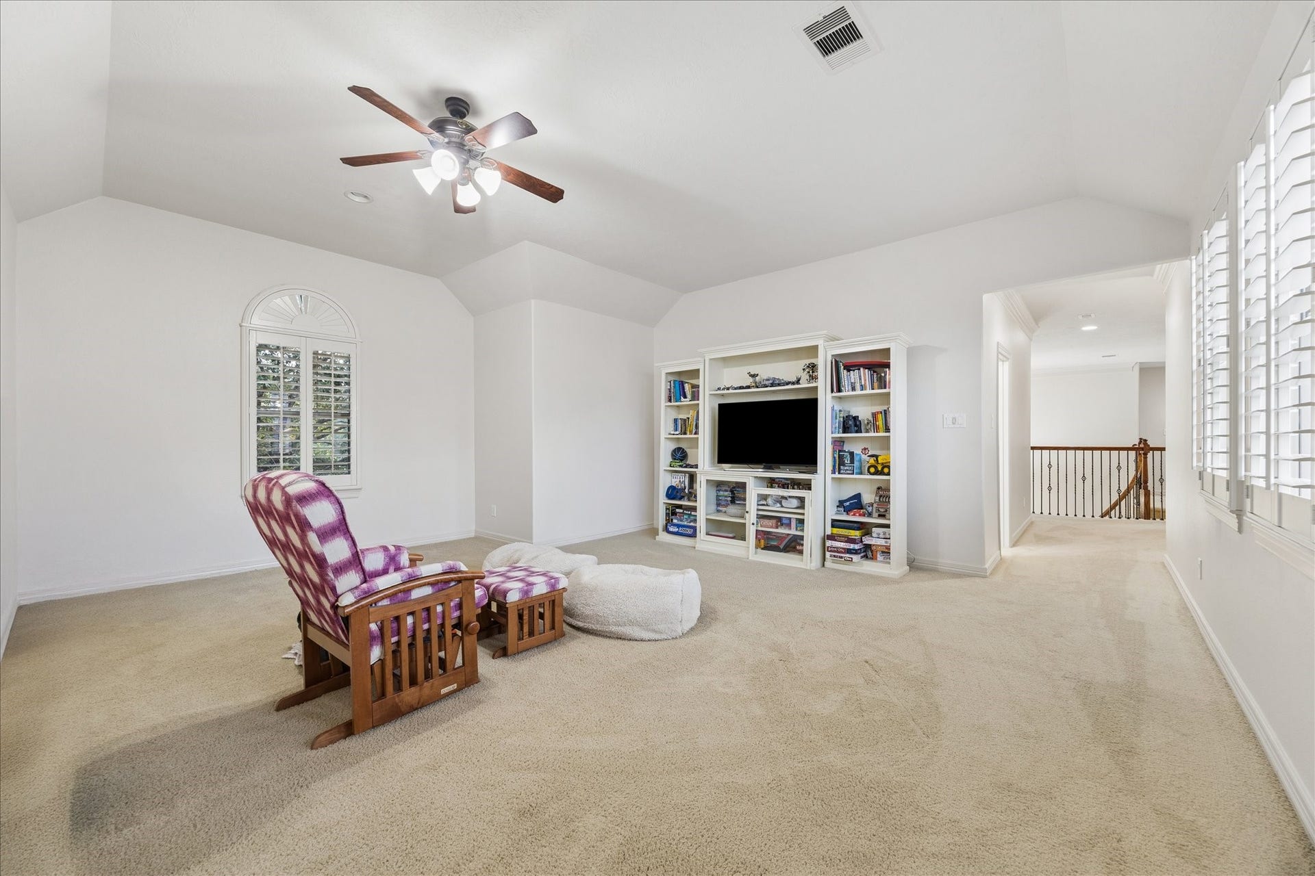 The game room is closed from the open gallery, allowing for sound separation from the main living room.