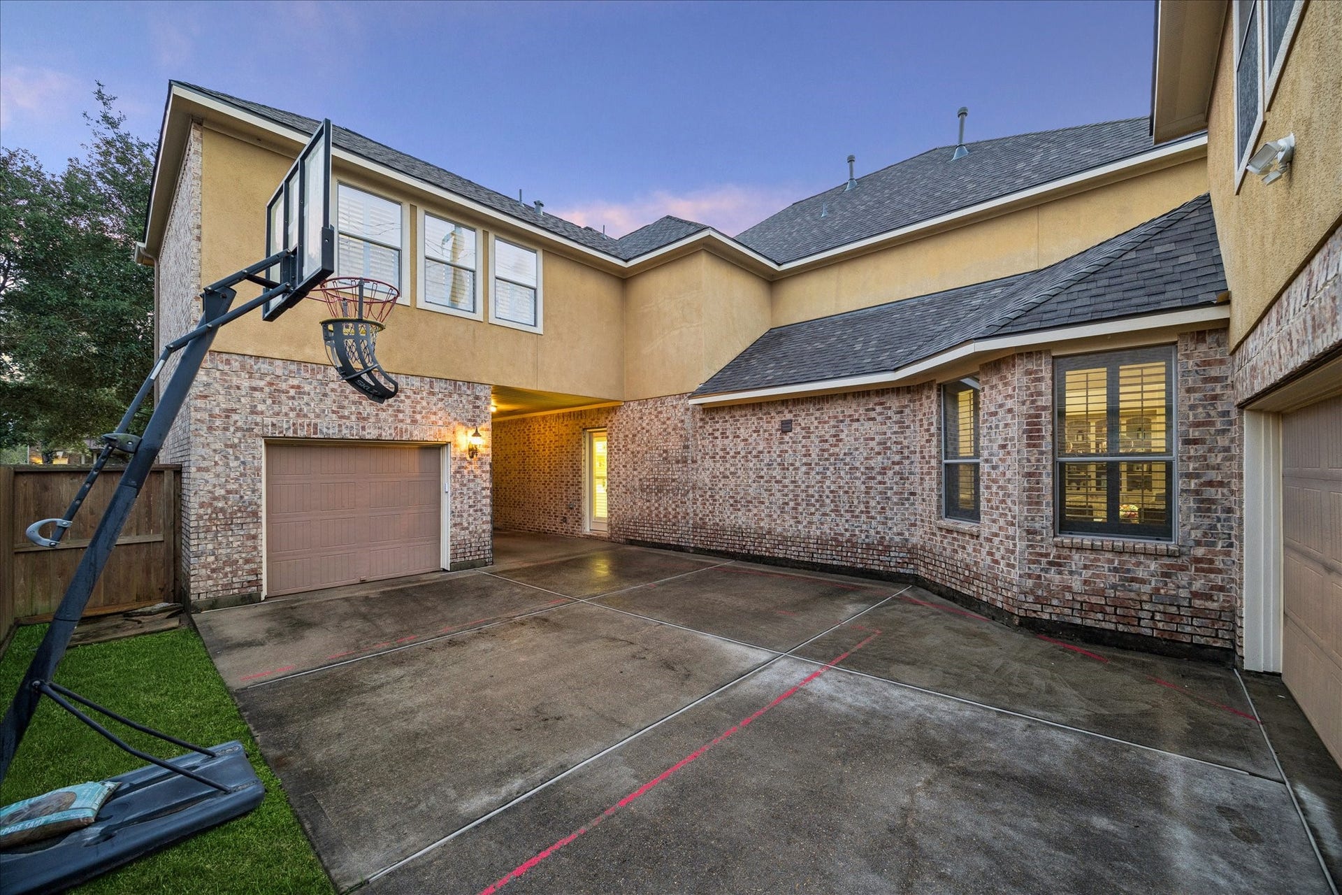 The parking court with two car garage on the back and one car toward the front.  You can park a fourth car under cover in the breezeway.  The gated breezeway gives you extra security.