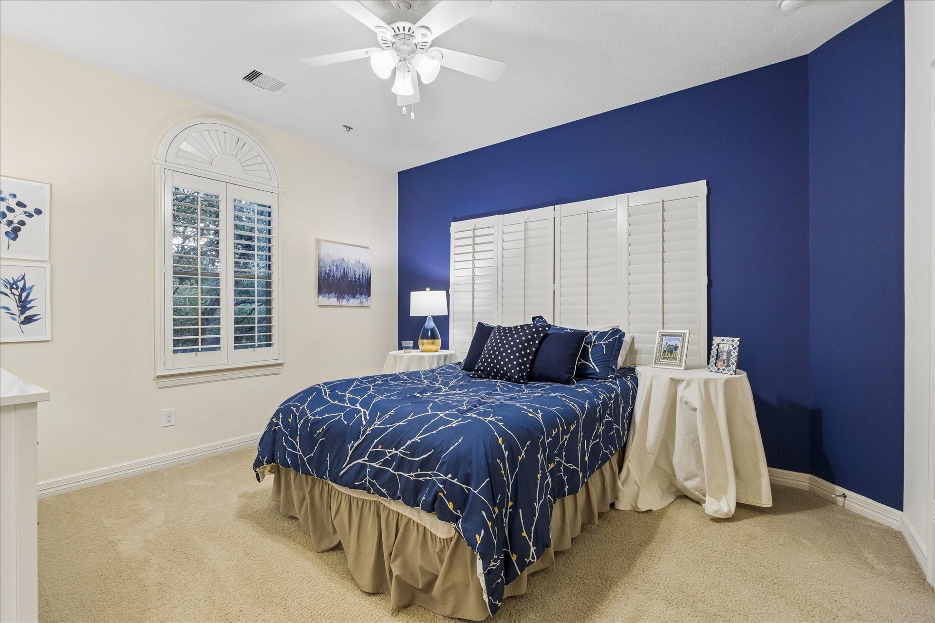The third bedroom sits opposite the breezeway near the game room.