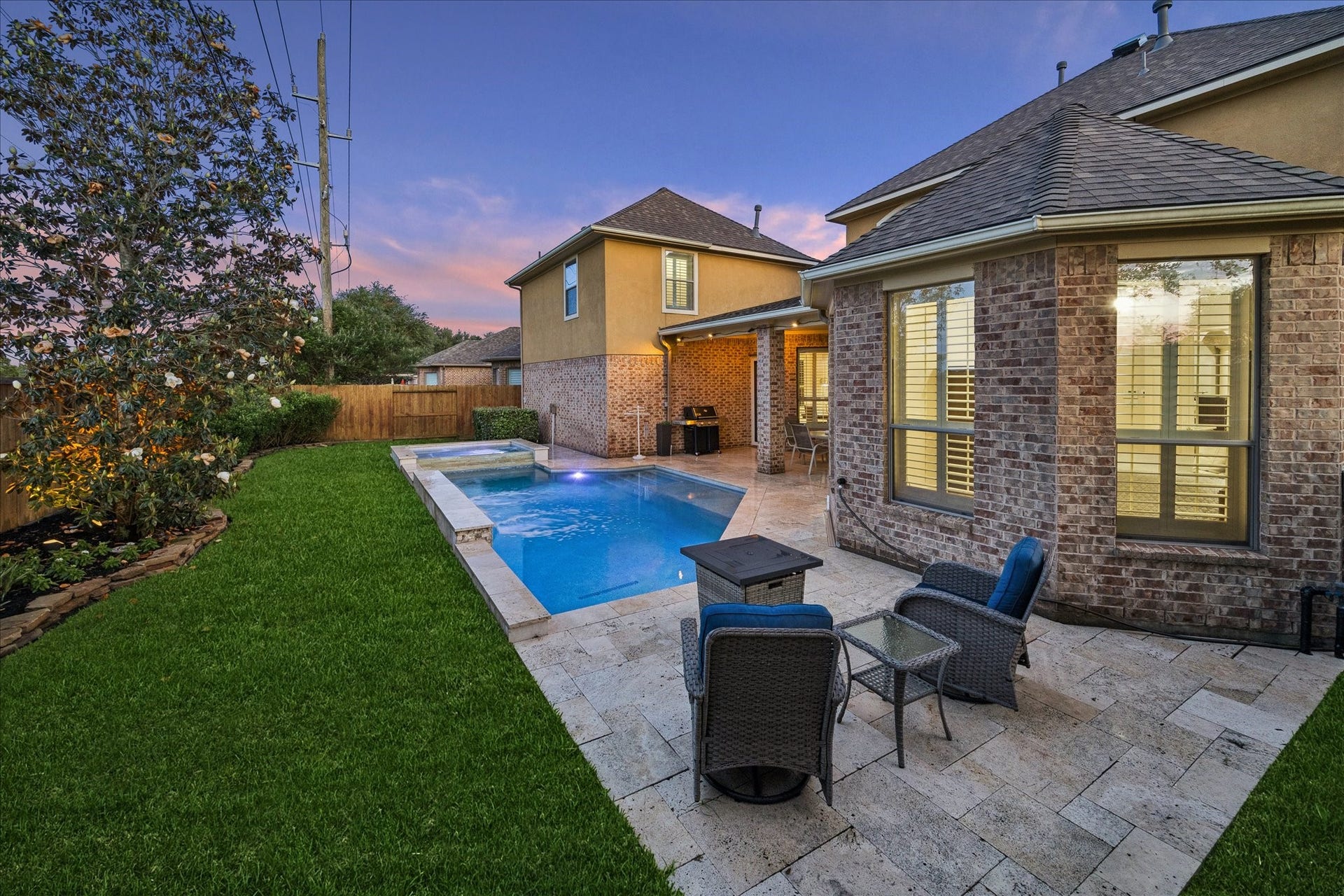 Another view of the pool and the primary bedroom windows.