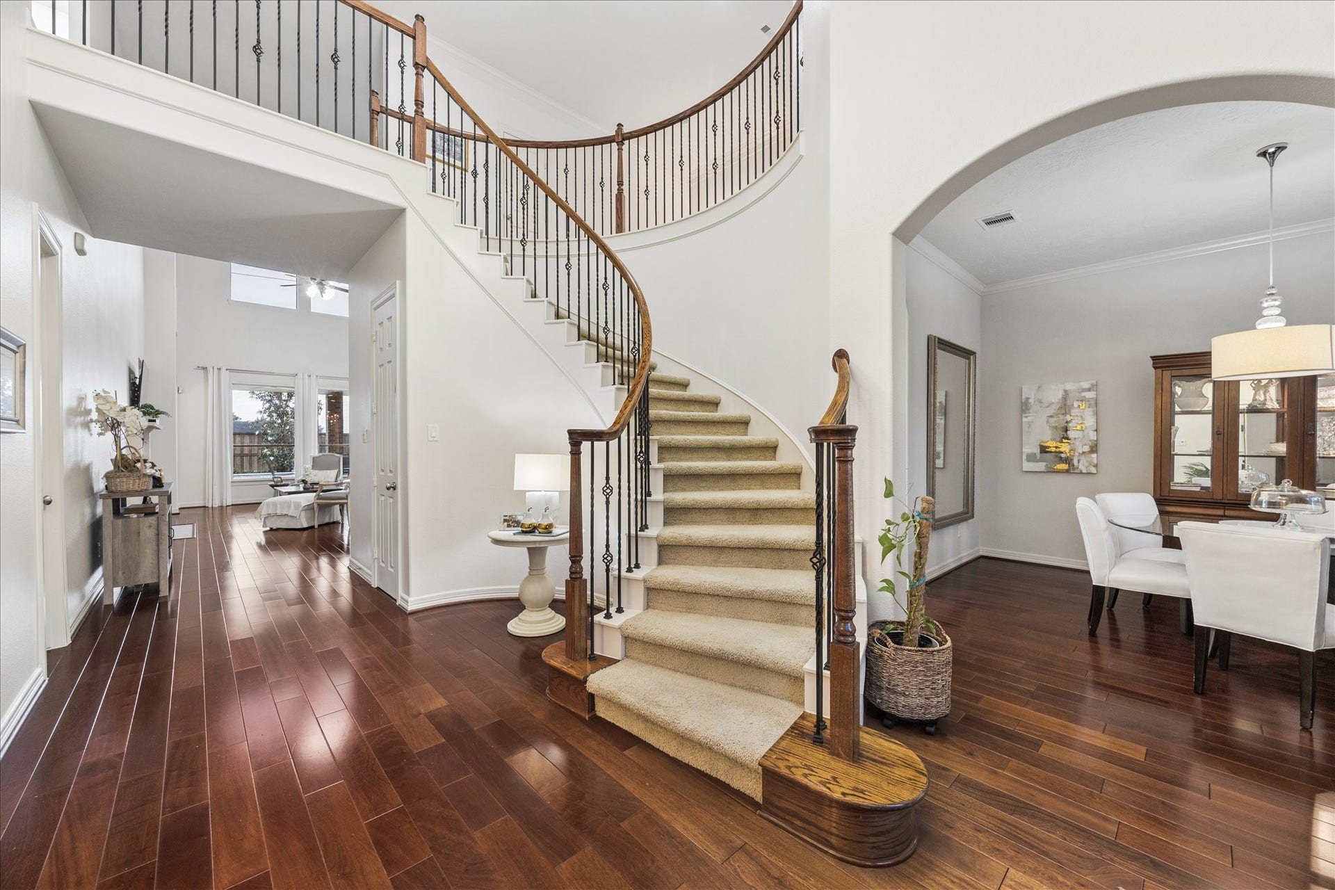 Step inside and you are greeted by a gorgeous stair sweeping to the upper gallery.